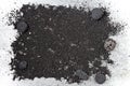 Black volcanic sand background with lava rocks