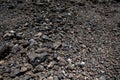 Black volcanic stones soil texture Royalty Free Stock Photo