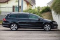 Black Volkswagen passat on side view parked in the street