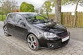 Black Volkswagen VW Golf GTI sports car in Germany Royalty Free Stock Photo