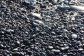 Black vulcanic stones on a black sand beach as a background, El Golfo, Lanzarote, Canary Islands, Spain Royalty Free Stock Photo