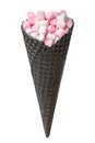 Black waffle cone with white and pink marshmallows isolated on w Royalty Free Stock Photo