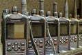 Black walkie talkies sitting on battery chargers. Royalty Free Stock Photo