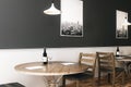 Black wall above wooden furniture in cafe Royalty Free Stock Photo