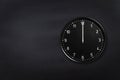 Black wall clock showing midnight black chalkboard background Royalty Free Stock Photo