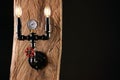 Black wall lamp made of water pipes Royalty Free Stock Photo