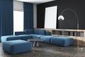 Black wall living room, blue sofa, poster, side Royalty Free Stock Photo