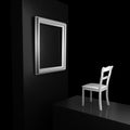 Empty chair in front of an empty picture frame Royalty Free Stock Photo