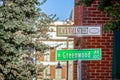 Black Wall Street and N Greenwood Avenue street signs - closeup - in Tulsa Oklahoma with bokeh background