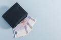 Black wallet and 500 euro bills on gray Royalty Free Stock Photo