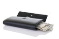 Black Wallet With Money Spilling Out Royalty Free Stock Photo