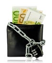 Black wallet with money tied with chain and padlock