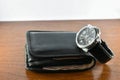 Black watch and wallet Royalty Free Stock Photo