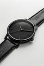 A black watch on a white surface with a black strap. Generative AI Royalty Free Stock Photo