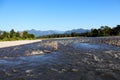 Black water Kameng river flowing through forested valley of Himalaya near Bomdila, Arunachal Pradesh, India.Sunny morning with