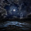 On the black water sailboat under the full moon. Royalty Free Stock Photo