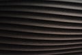 Black wavy abstract background. Curved embossed ceramic tile texture, grainy surface Royalty Free Stock Photo