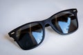 Black wayfarer sunglasses on white background