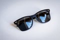 Black wayfarer sunglasses on white background Royalty Free Stock Photo