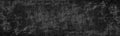 Black weathered concrete wall. Dark old rough cement distressed wide texture. Grunge textured panoramic background Royalty Free Stock Photo