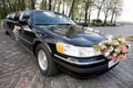 Black Wedding Limousine. Ornated with flowers