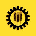 Black Wheat and gear icon isolated on yellow background. Agriculture symbol with cereal grains and industrial gears