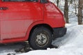 Black wheel on a red car, a minibus Royalty Free Stock Photo