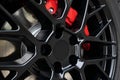 Black Wheel rim and red brake caliper of a sport car