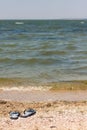 Black and Whiet Sandals on the beach