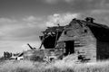 Black and white abandoned barn, aftermath of storm