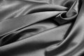 Black white abstract background. Beautiful folds on shiny fabric. Silk satin texture background. Elegant silver background. Royalty Free Stock Photo