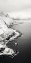 Black And White Aerial Photography Of Winter Fjord And Rocky Beach