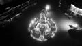 Black and white Aerial View of Allama Iqbal Road roundabout in night with lights, buildings and traffic