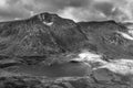 Black and white Aerial view of flying drone Epic dramatic Autumn landscape image of Llyn Idwal in Devil`s Kitchen in Snowdonia