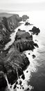 Black And White Aerial View Photography Of Coastal Rocks And Cliffs