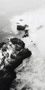 Black And White Aerial View Photography Of Ocean Waves Crashing Over Rocks