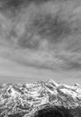 Black-and-white Alpine landscape and snow-capped peaks. Lots of mountains