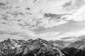 Black-and-white Alpine landscape. The tops of the mountains with the snow