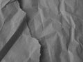 Black white background. Crumpled paper texture. Wrinkled torn paper. Royalty Free Stock Photo