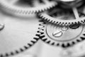 Black white background with metal cogwheels a clockwork. Macro