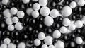 Black and white balls fill the screen. Spheres fill the volume. Dragee or pills. 3D render.