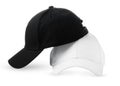 Black and White Baseball Caps Positioned Side by Side on a Clean White Background Royalty Free Stock Photo