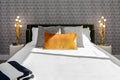 Black and white bedroom with gold accents and wallpaper Royalty Free Stock Photo