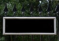 Black and White Blank Sign Mounted on Black Railings Royalty Free Stock Photo