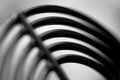 Blurry image of abstract metal object in black and white.