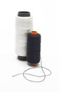 Black and white bobbins of threads