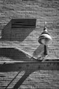 Black and White - brick wall and light fixture Royalty Free Stock Photo
