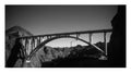 Black and white bridge over clear skies Royalty Free Stock Photo