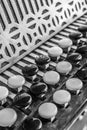 Black and white buttons on button accordion close-up Royalty Free Stock Photo
