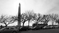 Washington Monument against traffic and Big Bus